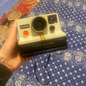 Vintage Polaroid camera. Rainbow stripe.